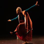 African American woman walking an imaginary tightrope