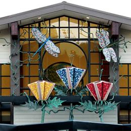 sculpture of flowers and hummingbird