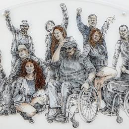 engraving of wheel chair users raising hands above heads on glass