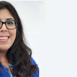 dark-haired woman in glasses